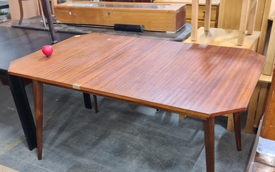 A stylish mid century modern dining table with angular cut c...