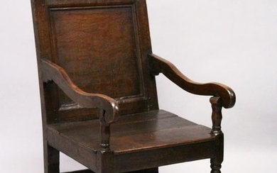 AN 18TH CENTURY OAK WAINSCOT ARMCHAIR, with panelled