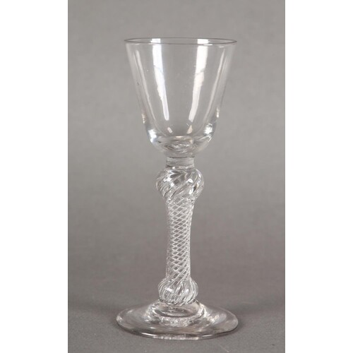 AN 18TH CENTURY WINE GLASS with bucket shaped bowl on a mult...