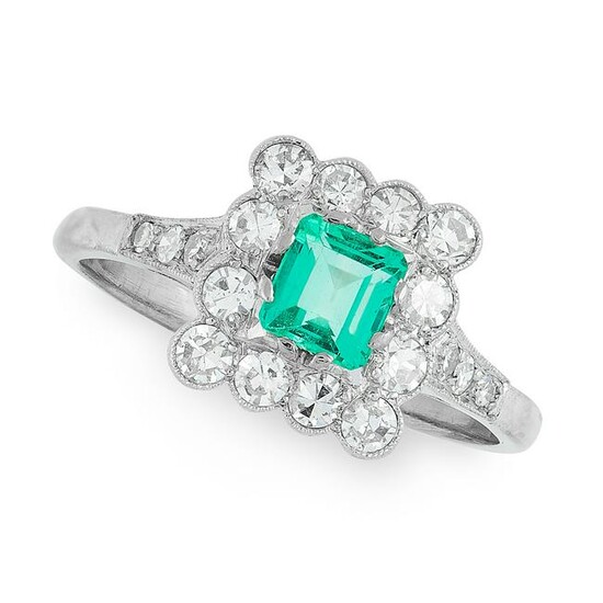 AN EMERALD AND DIAMOND DRESS RING set with an emerald