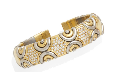 An 18k bi-color gold and diamond bangle