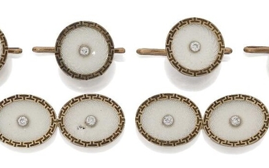 An Art Deco gold, diamond and enamel dress set, comprising a pair of cufflinks, designed as oval pale blue guilloche enamel panels with central old-brilliant-cut diamond with engraved key pattern borders, and four matching circular dress buttons...