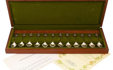 An Elizabeth II cased set of twelve silver RHS Flower spoons'