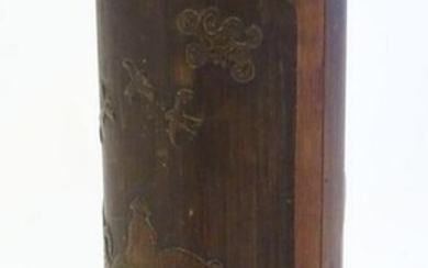 An Oriental carved bamboo vase depicting a figure on a