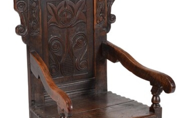 An oak panel back armchair
