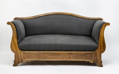 Biedermeier sofa. Walnut. On slightly flared legs, smooth...