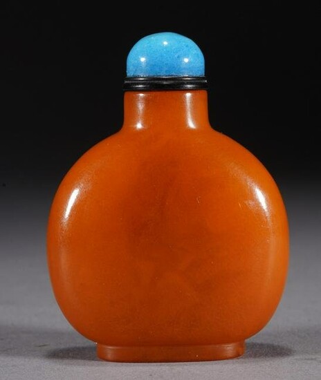 Chinese Orange Amber Carved Round Snuff Bottle