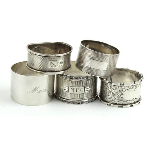 Collection of five silver napkin rings, various British hall...