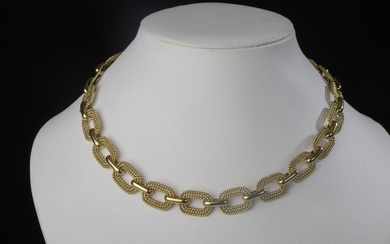 Articulated necklace in 18k yellow gold, the links engraved with twisted decoration.