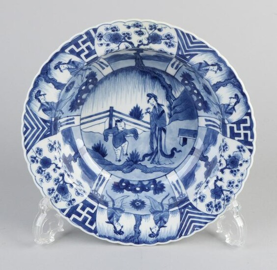 Deep Chinese porcelain dish with garden figures and