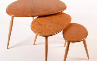 Ercol: a light elm and beech nest of three tables.