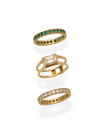 Fancy coloured diamond ring, diamond eternity ring, and emerald eternity ring