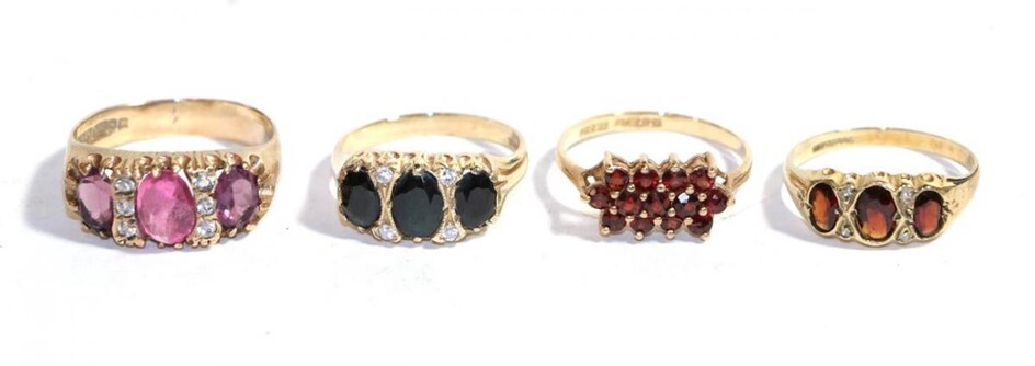 Four 9 carat gold gem set dress rings including garnet...