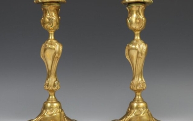 France, a pair of brass one-light candlesticks in...