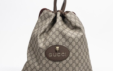 SOLD. Gucci: A "Neo Vintage Drawstring Backpack" af brunt coated canvas, yellow and brown leather trimmings, brass hardware and two handles. – Bruun Rasmussen Auctioneers of Fine Art