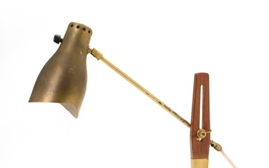 Hans Bergström: Brass table lamp with mahogany stem. Adjustable arm and shade with pierced star pattern. Manufactured and marked by Atelje Lyktan.