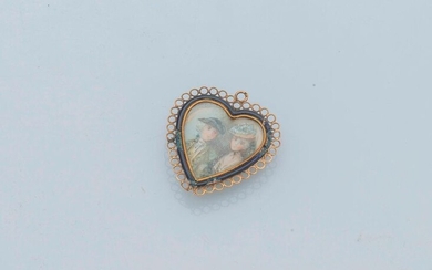 Heart shaped 18 karat (750 mils) yellow gold pendant in the shape of a heart, enhanced with blue enamel and filigree. The pendant opens, containing a miniature depicting a couple in the fashion of the 18th century painted. French work of the 18th...