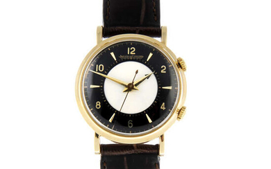 JAEGER-LECOULTRE - an 18ct yellow gold Memovox wrist watch, 32mm.