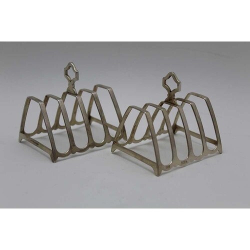 Mappin & Webb, a pair of Art Deco silver toast racks, angula...