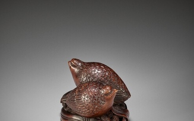 OKATOMO: A RARE STAINED WOOD NETSUKE OF TWO QUAILS ON MILLET