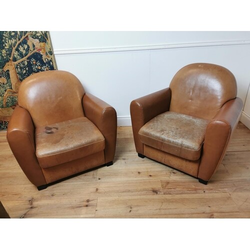Pair of leather upholstered tub chairs raised on tapered fee...