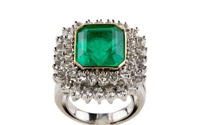 Platinum ring with emerald and diamonds.