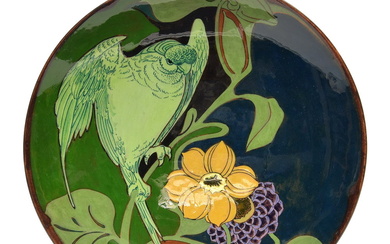 Polychrome painted earthenware wall dish depicting a bird...