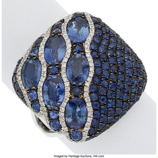 Sapphire, Diamond, White Gold Ring The ring features round...