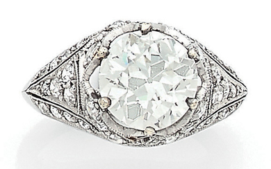 Solitaire platinum ring (850) centered on an antique...