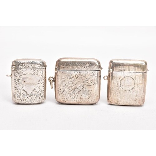 THREE EARLY 20TH CENTURY SILVER VESTAS, the first with an en...