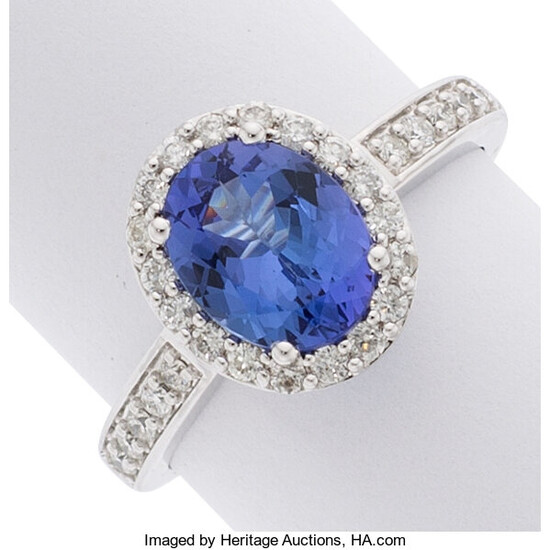 Tanzanite, Diamond, White Gold Ring The ring features an...