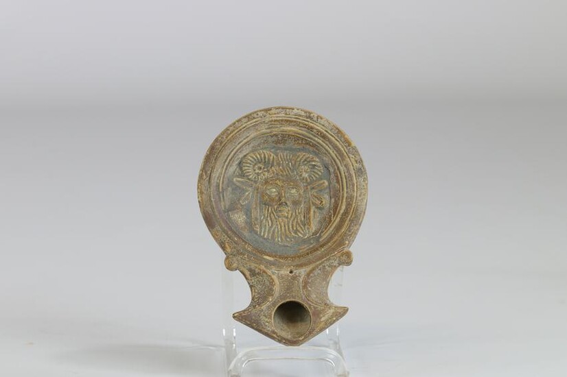 Terracotta oil lamp with representation of the deity