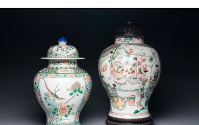 Two Chinese famille verte porcelain vases and covers on wood...