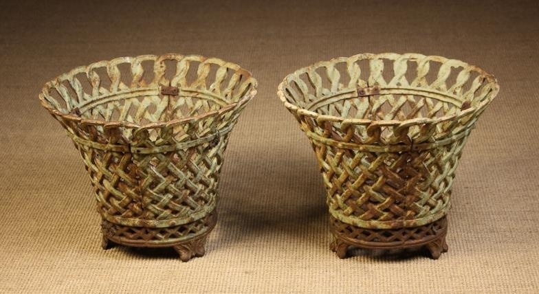 Two Large Cast Iron Garden Basket Planters. The flared...