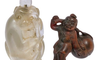Two carved Asian figural snuff bottles; rock crystal monkey and boxwood longevity figure with peach.