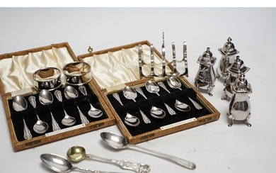 Two cased sets of six silver coffee spoons, a set of four si...
