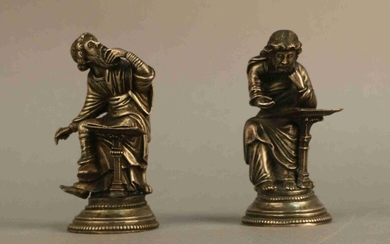 Two silver STATUTES representing characters (apostles?) sitting, writing. Gothic style, 19th century. To be checked. Height : 12 cm Weight : 754,4 g