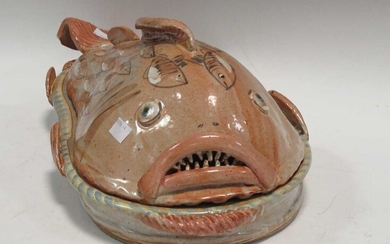 Willie Carter, a glazed stoneware serving dish and cover in the modelled as a fish, stamped 'Willie'