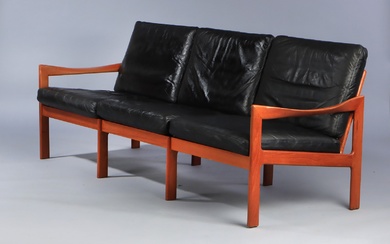 llum Wikkelsø. Trepers sofa in teak, model 20, black leather.