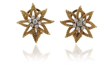 A pair of diamond flowerhead earrings, set with...
