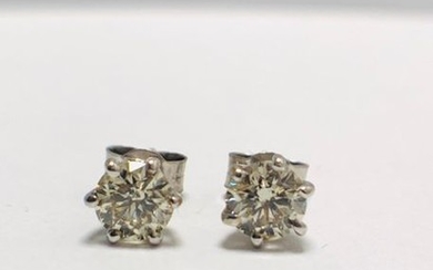 1.50 Diamond set solitaire style earrings. Each set...