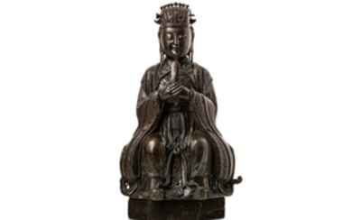 A CHINESE BRONZE FIGURE OF AN OFFICIAL.