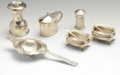 A selection of items to include an Edwardian imported silver tea strainer of Arts and Craft style, etc.