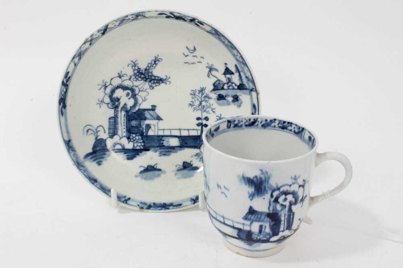 18th century Lowestoft blue and white porcelain cup and saucer, c. 1775, decorated with chinoiserie pattern, painter's mark inside footrim of cup
