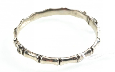 A VINTAGE SILVER HINGED BAMBOO STYLE BANGLE, RUBBED HALLMARKS