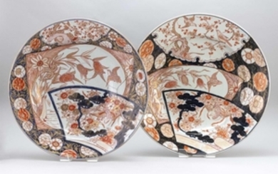 NEAR-PAIR OF IMARI PORCELAIN OVERSIZED CHARGERS Both with alternating decoration of birds on millet and flowering tree blossoms, on...