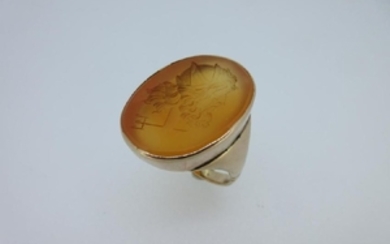 A carved cornelian intaglio ring