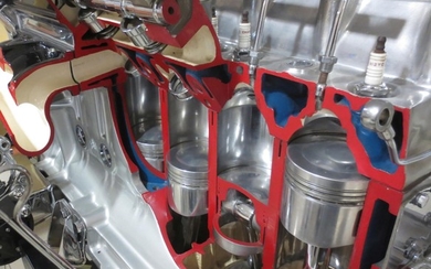 A cut-away 4.2 litre Jaguar 6 cylinder dohc fuel injected engine