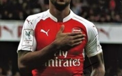 Football Theo Walcott 16x12 signed colour photo pictured in action for Arsenal. Good Condition. All signed pieces come with...