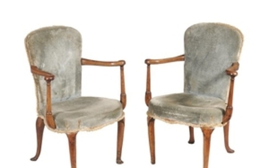 A pair of George I walnut and upholstered armchairs